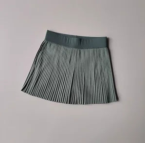 KiKis Women's Organ Pleated Tennis Skirt in muted green with elastic waistband