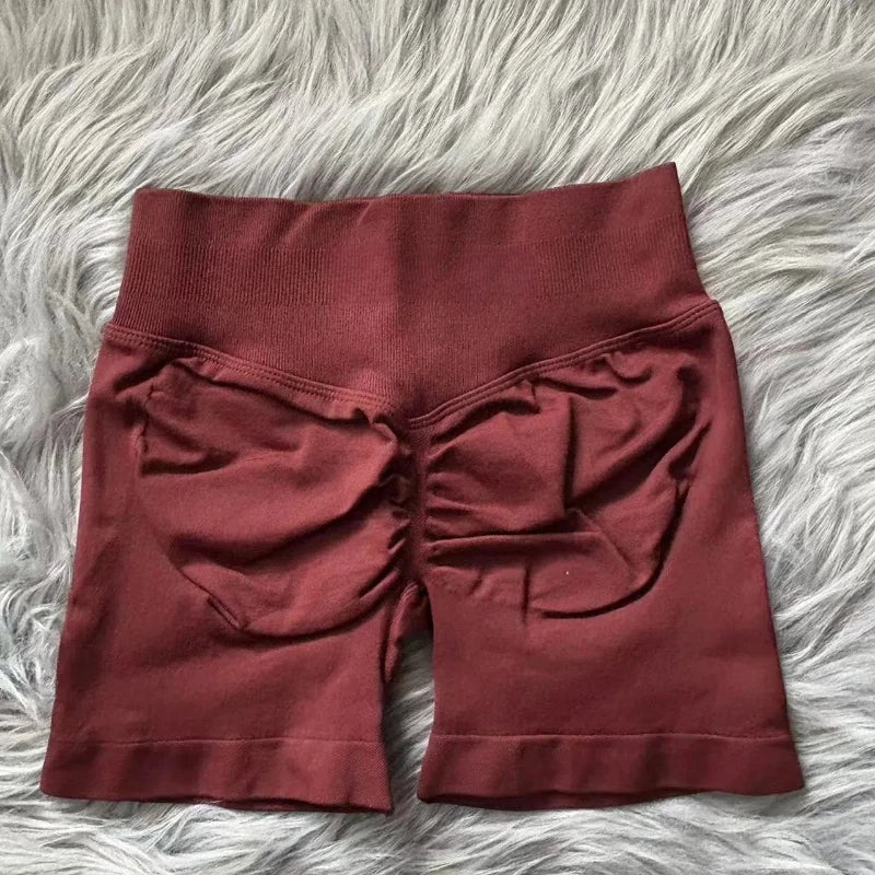 KiKis women's peach hip yoga shorts in dark peach color with ruched back design on soft fabric