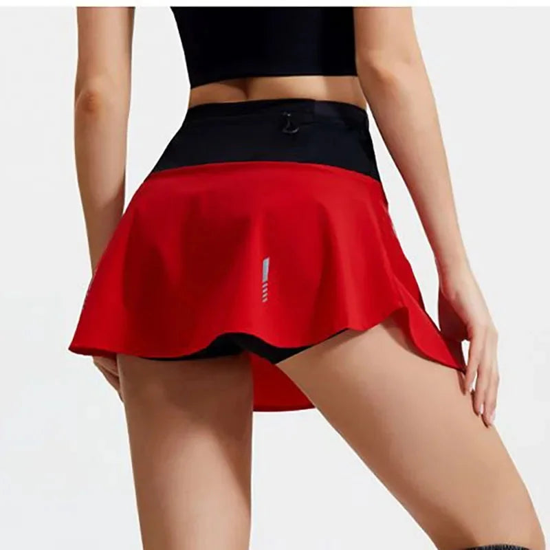 KiKis women's quick dry tennis skirt in red with black waistband for active sports