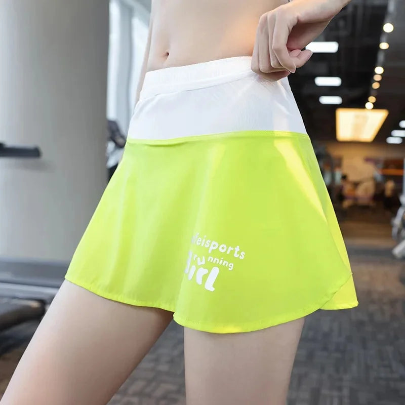 KiKis women's quick dry tennis skirt in white and lime green with sporty logo print