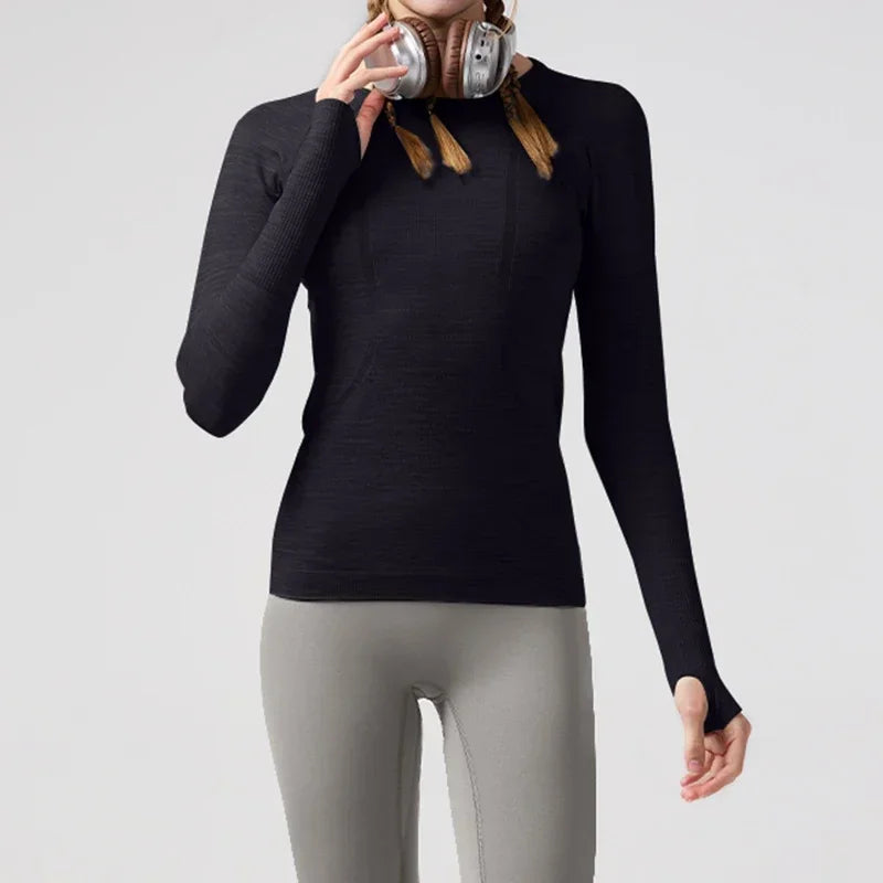 KiKis women's quick dry workout shirt in black with long sleeves and thumb holes