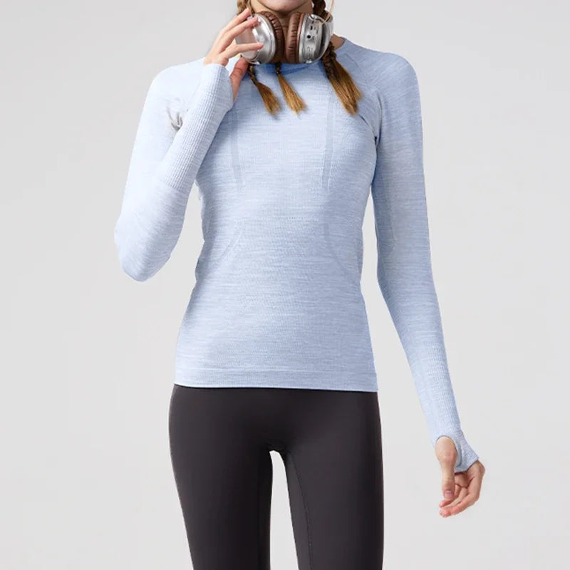 KiKis women's quick dry workout shirt in light blue with long sleeves and thumb holes