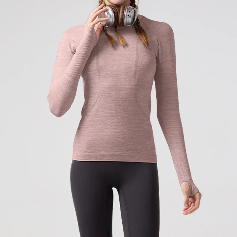 KiKis women's quick dry workout shirt in pink long sleeve with thumb holes and fitted design