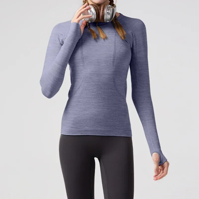 KiKis women's quick dry workout shirt in purple long sleeve with thumb holes worn by model