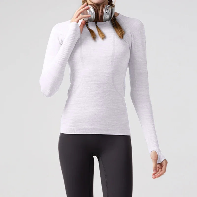KiKis women's quick dry workout shirt in white with long sleeves and thumb holes