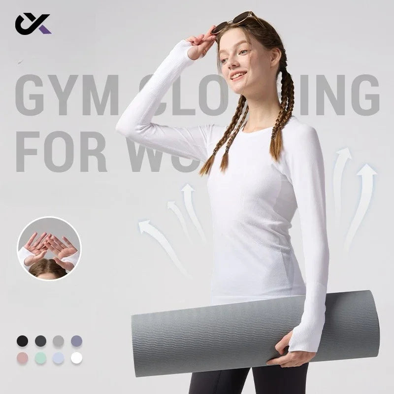 KiKis women's quick dry workout shirt in white with thumb holes worn by woman holding yoga mat