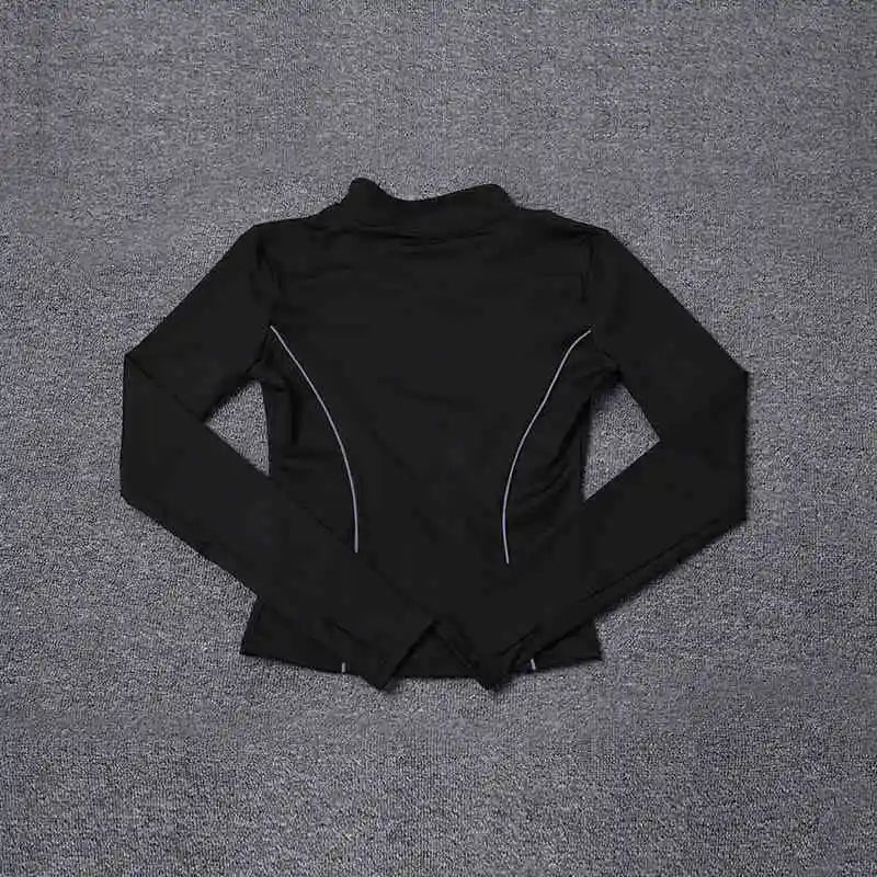 Black women's reflective yoga jacket by KiKis with long sleeves and reflective piping detail