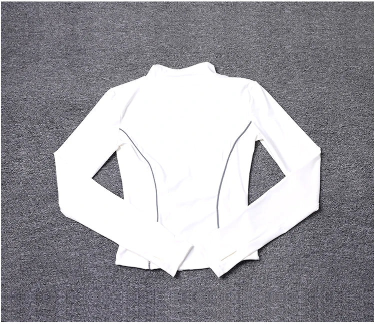 KiKis women's reflective yoga jacket in white with long sleeves and slim fit design