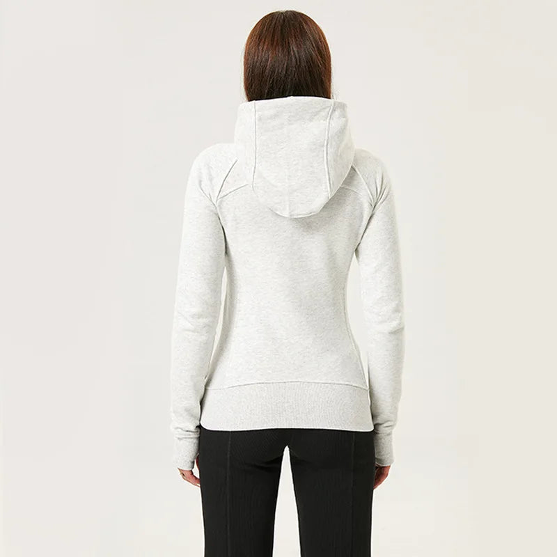 Back view of a woman wearing a light gray women's running zip up hoodie with a hood from KiKis