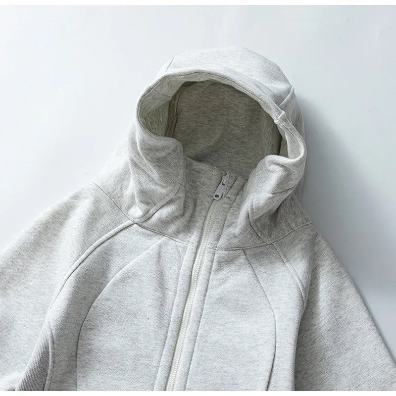 KiKis women's running zip up hoodie in light gray with hood and front zipper