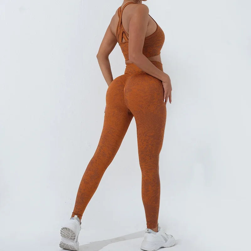 KiKis women's seamless yoga set in rust color featuring high-waisted leggings and a strappy sports bra