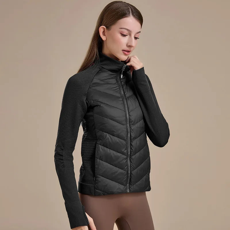 KiKis women's short down jacket in black with zip front and fitted knit sleeves