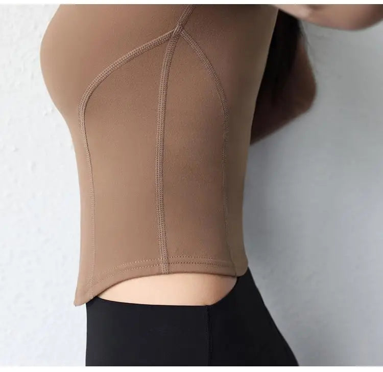 KiKis women's slim fit yoga jacket in brown close-up side view with detailed stitching