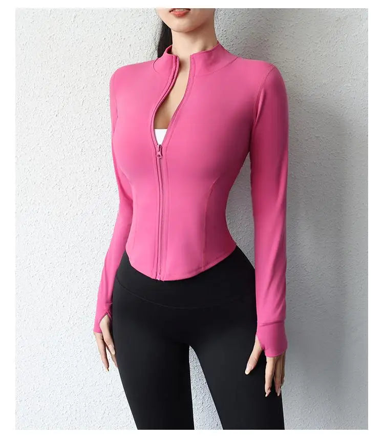 KiKis women's slim fit yoga jacket in pink with full zipper and thumb holes