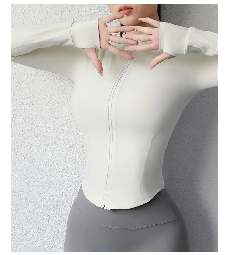 KiKis women's slim fit yoga jacket in white with full front zipper and thumb holes