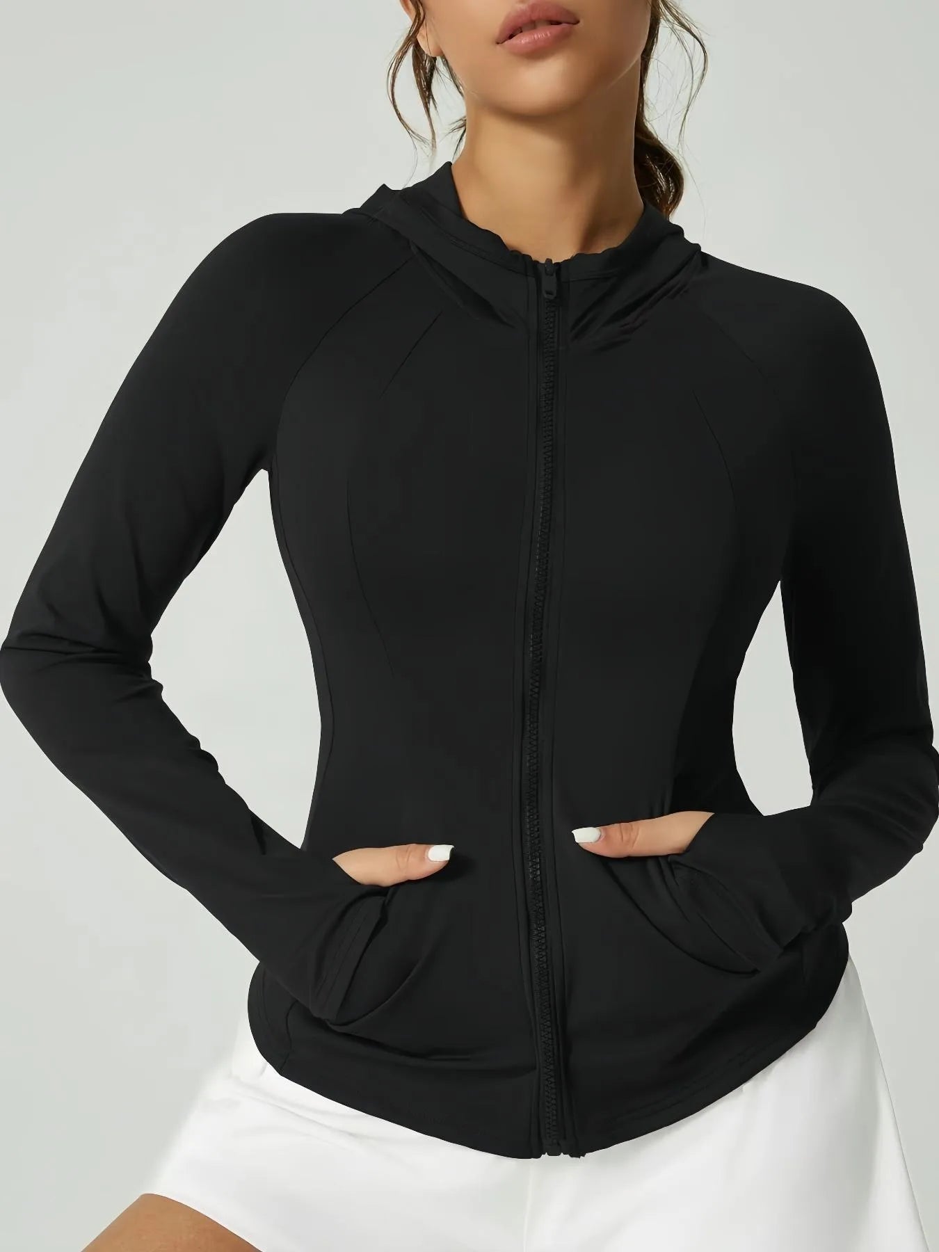 KiKis black women's thumb hole sports jacket with full zip and fitted design