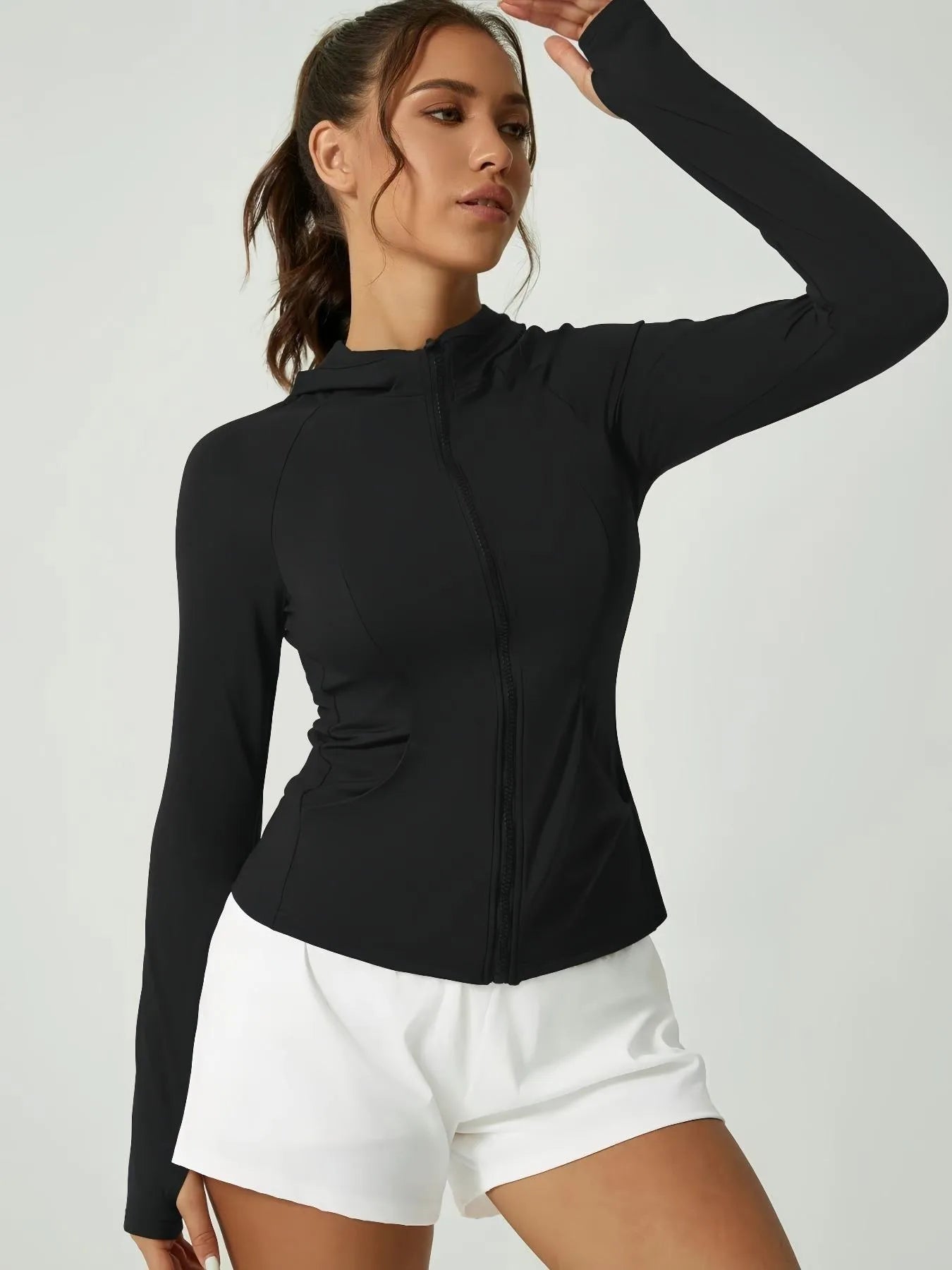 KiKis women's thumb hole sports jacket in black with full zip and fitted design