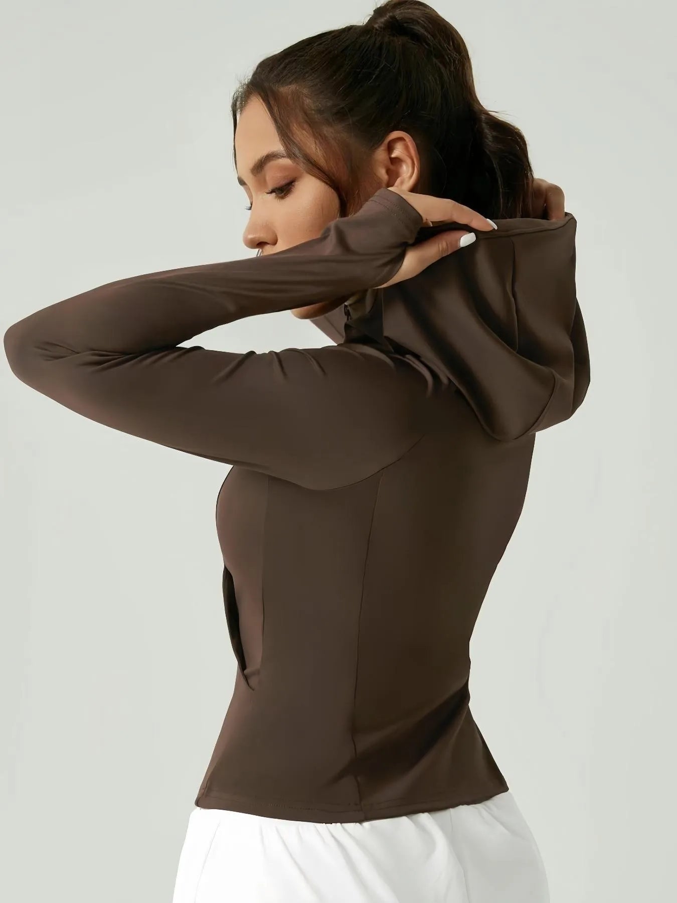 KiKis women's thumb hole sports jacket in brown with fitted design and hood