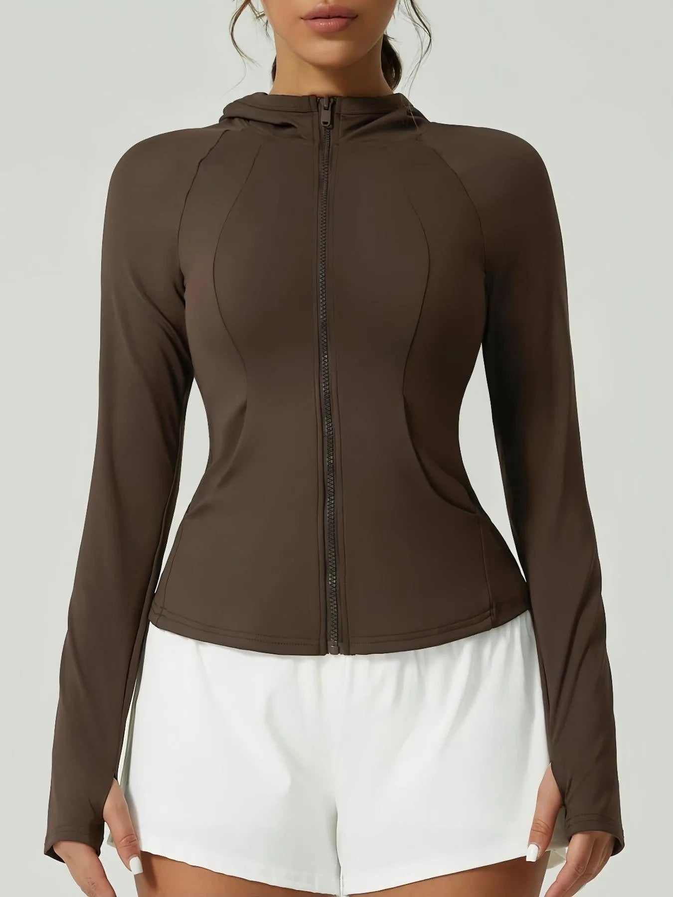 KiKis women's thumb hole sports jacket in brown with full front zipper and fitted design