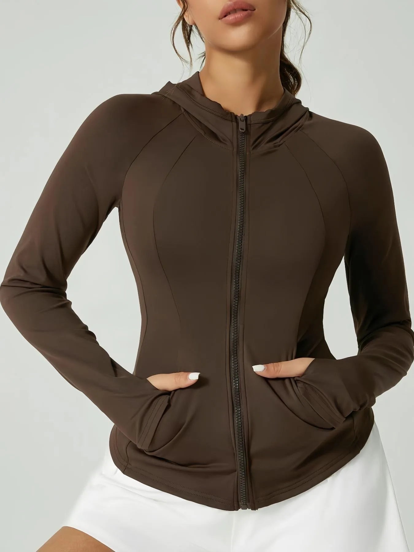 KiKis women's thumb hole sports jacket in brown with full zipper and attached hood