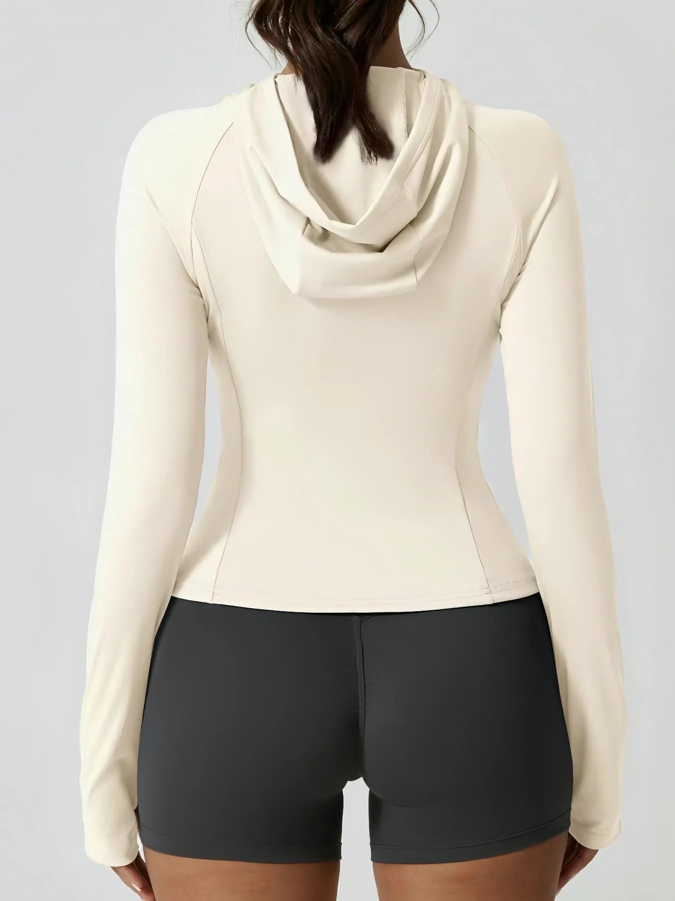 KiKis women's thumb hole sports jacket in cream color with hood and long sleeves