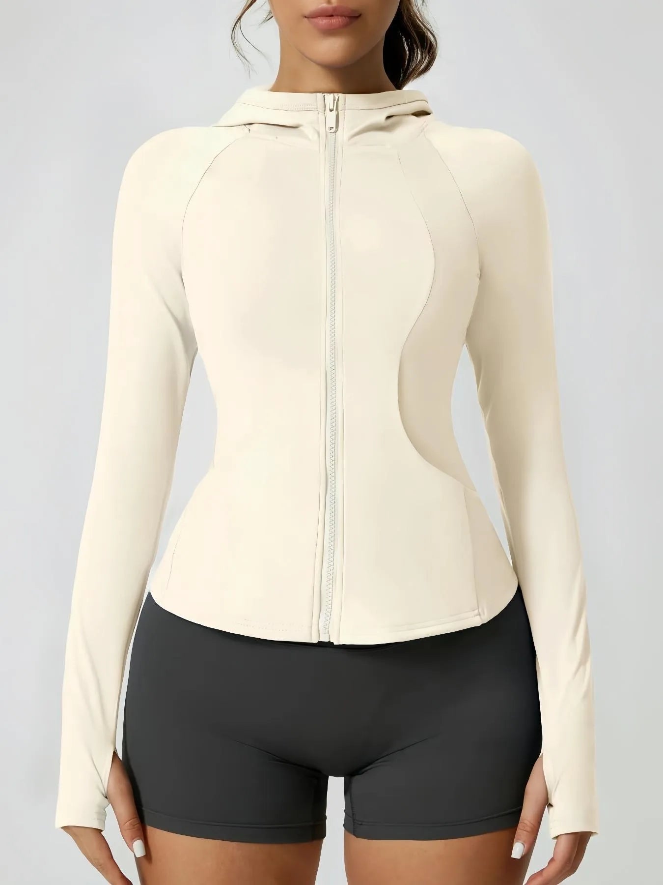 KiKis women's thumb hole sports jacket in cream color with full zip and fitted design