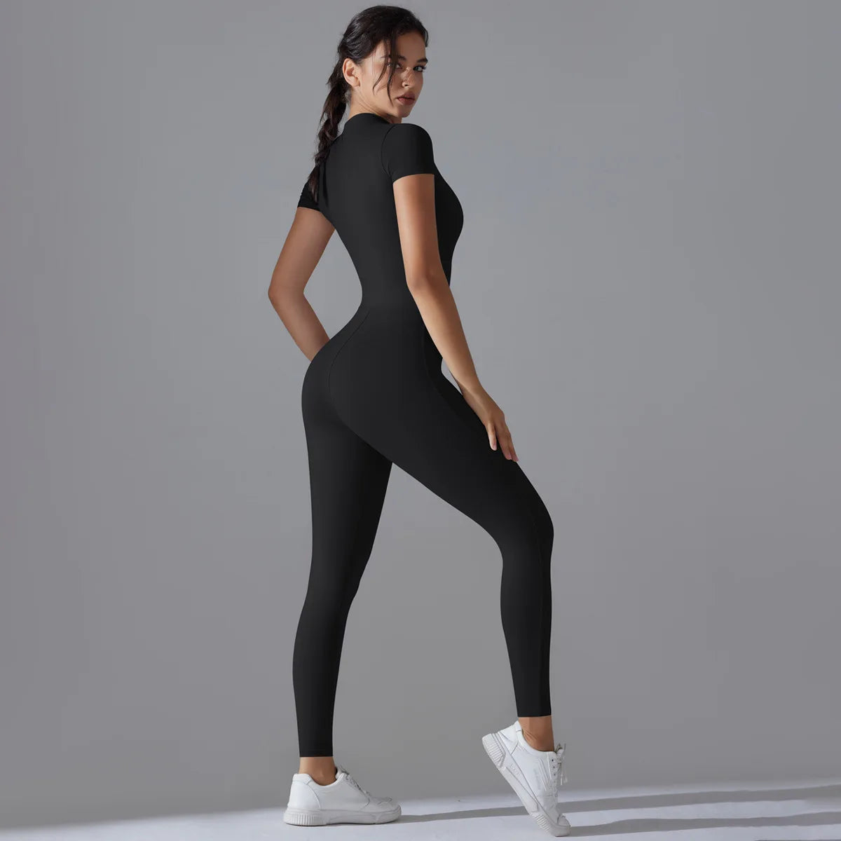 KiKis women's zipper yoga jumpsuit in black with short sleeves and fitted design