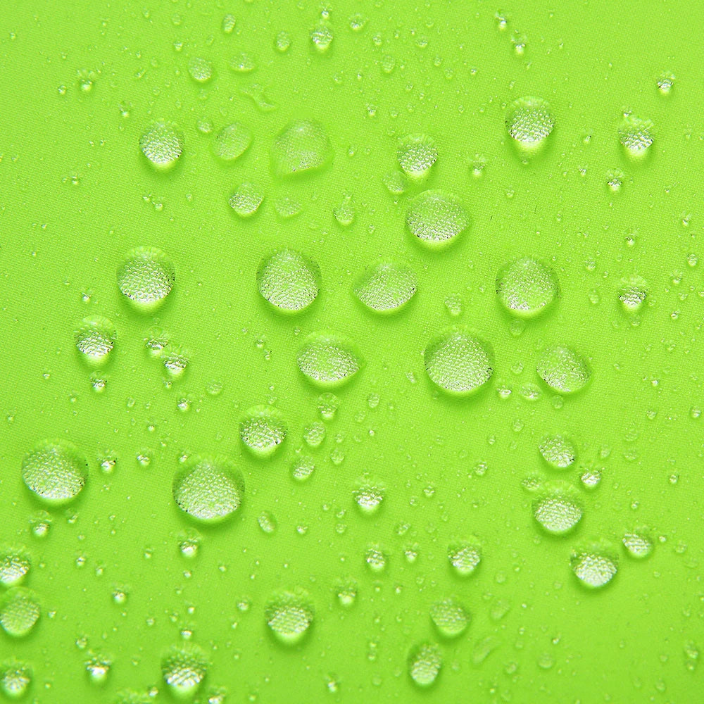 Close-up of water droplets on bright green fabric showcasing water resistance for Women's Reflective Cycling Jackets