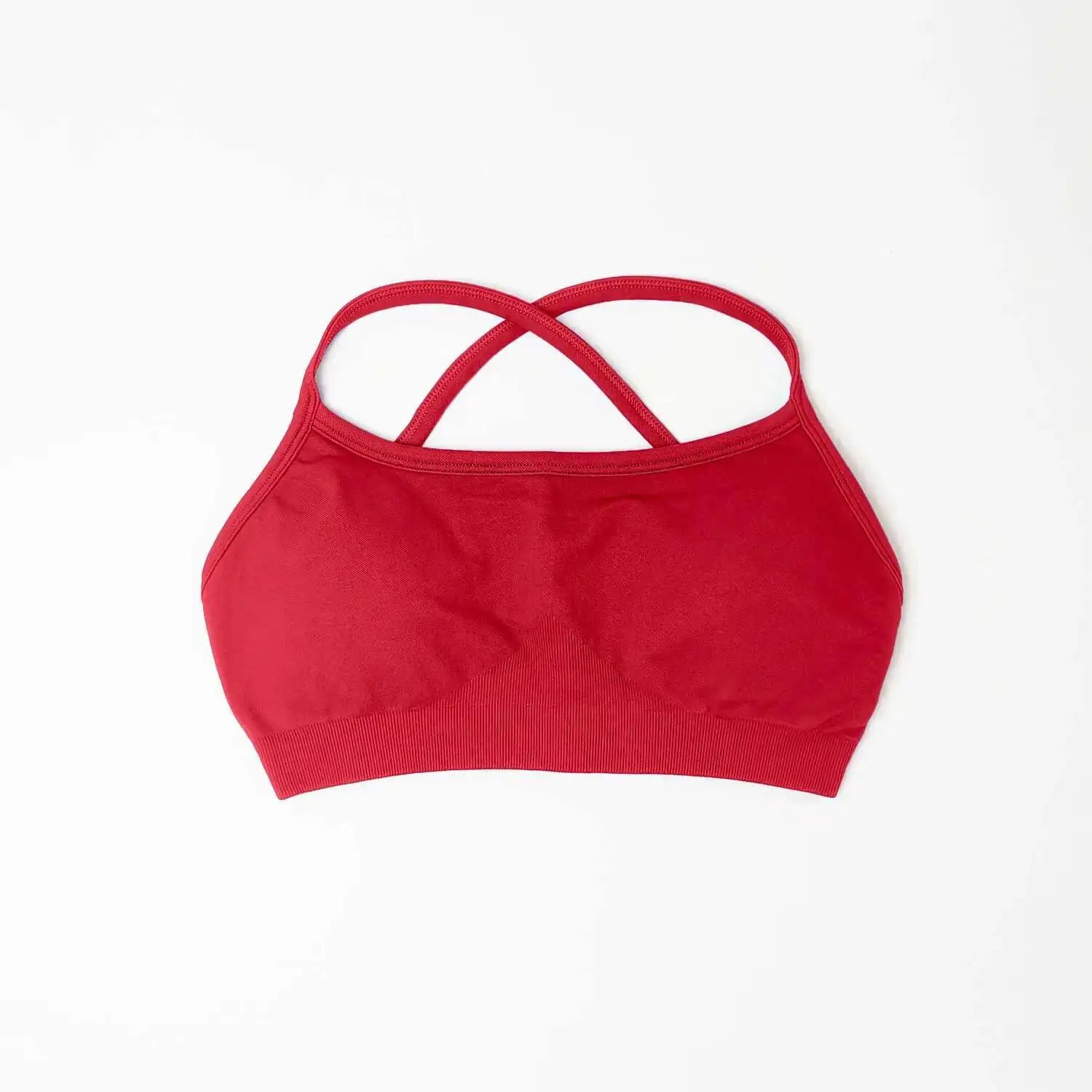 Red seamless sports bra for women with crossed back straps and soft stretch fabric