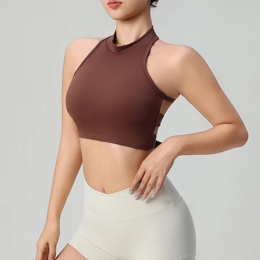 Brown comfortable workout tank tops for women with high neck and open back design worn with white shorts