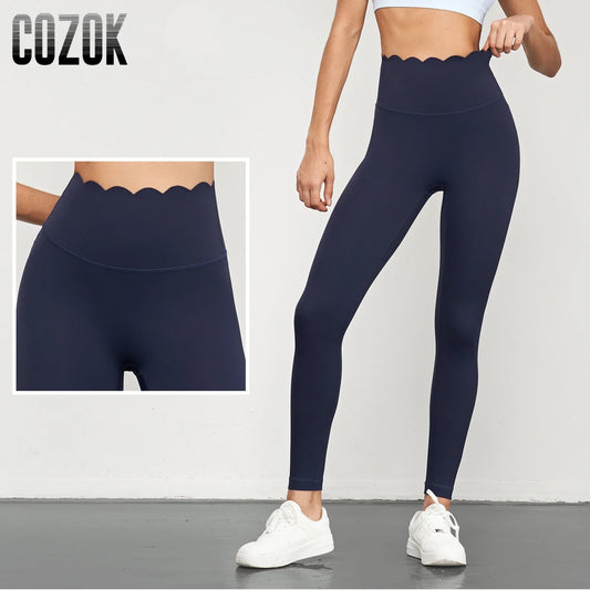 Women Seamless Lotus Arc Yoga Pants in navy blue with scalloped high waist and full length design