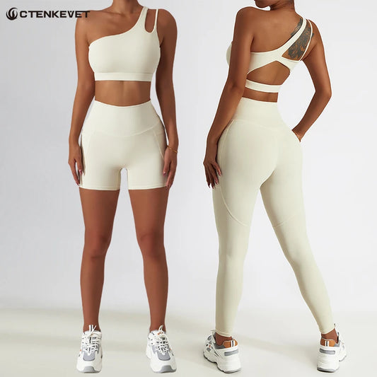 KiKis one shoulder sports bra and leggings set in beige shown front and back with shorts and full-length leggings