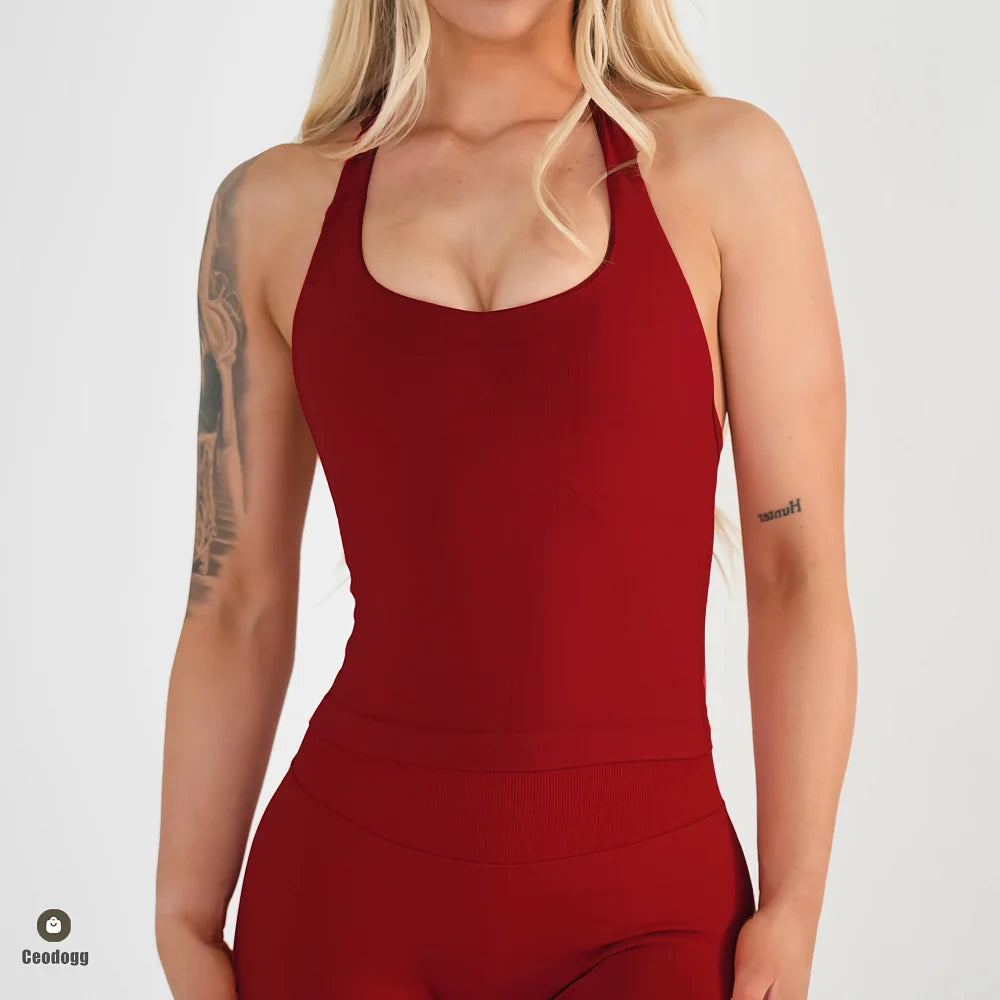 KiKis seamless backless sports tank top in red worn by model with tattooed arms