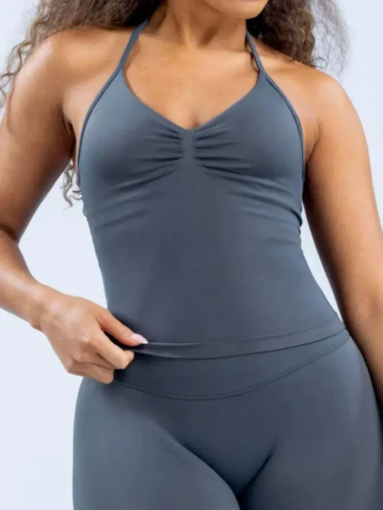 KiKis seamless yoga sports bra in dark gray with ruched front and halter neck design