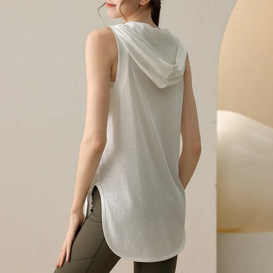 KiKis white summer sleeveless workout hoodie with hood and curved hem worn by woman from back