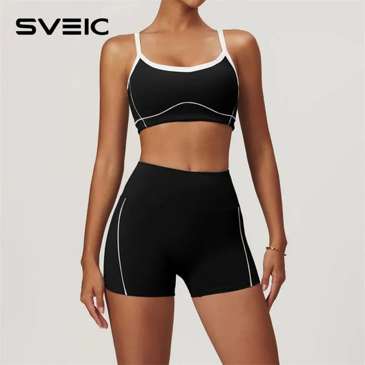 KiKis women's nude fitness shorts set in black with white trim modeled on a fit woman