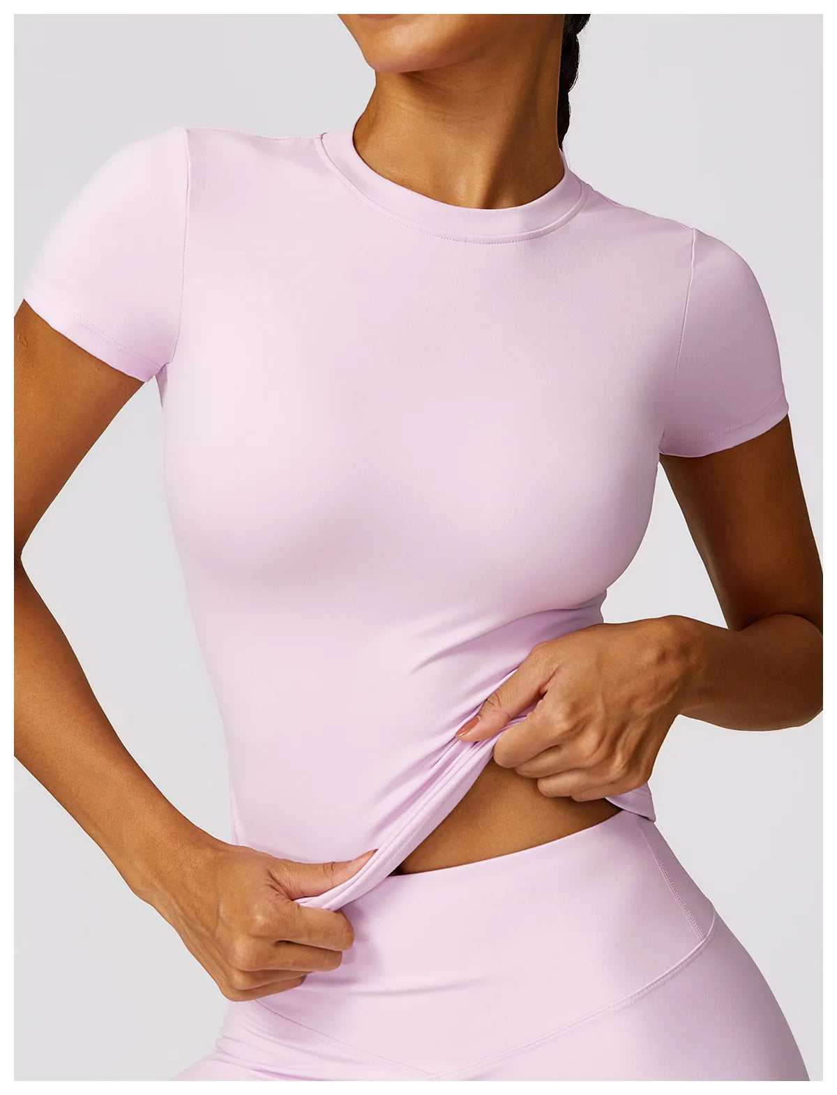 KiKis seamless yoga top for women in light pink stretch fabric with short sleeves