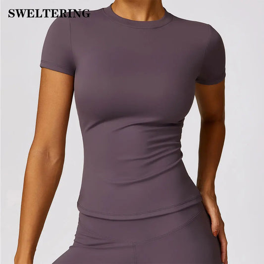 KiKis seamless yoga top for women in purple with short sleeves and fitted design