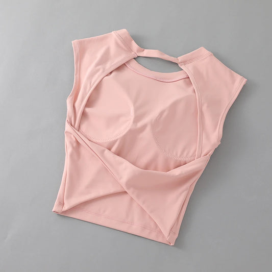KiKis women's backless sports tank top in light pink with short sleeves and built-in bra support