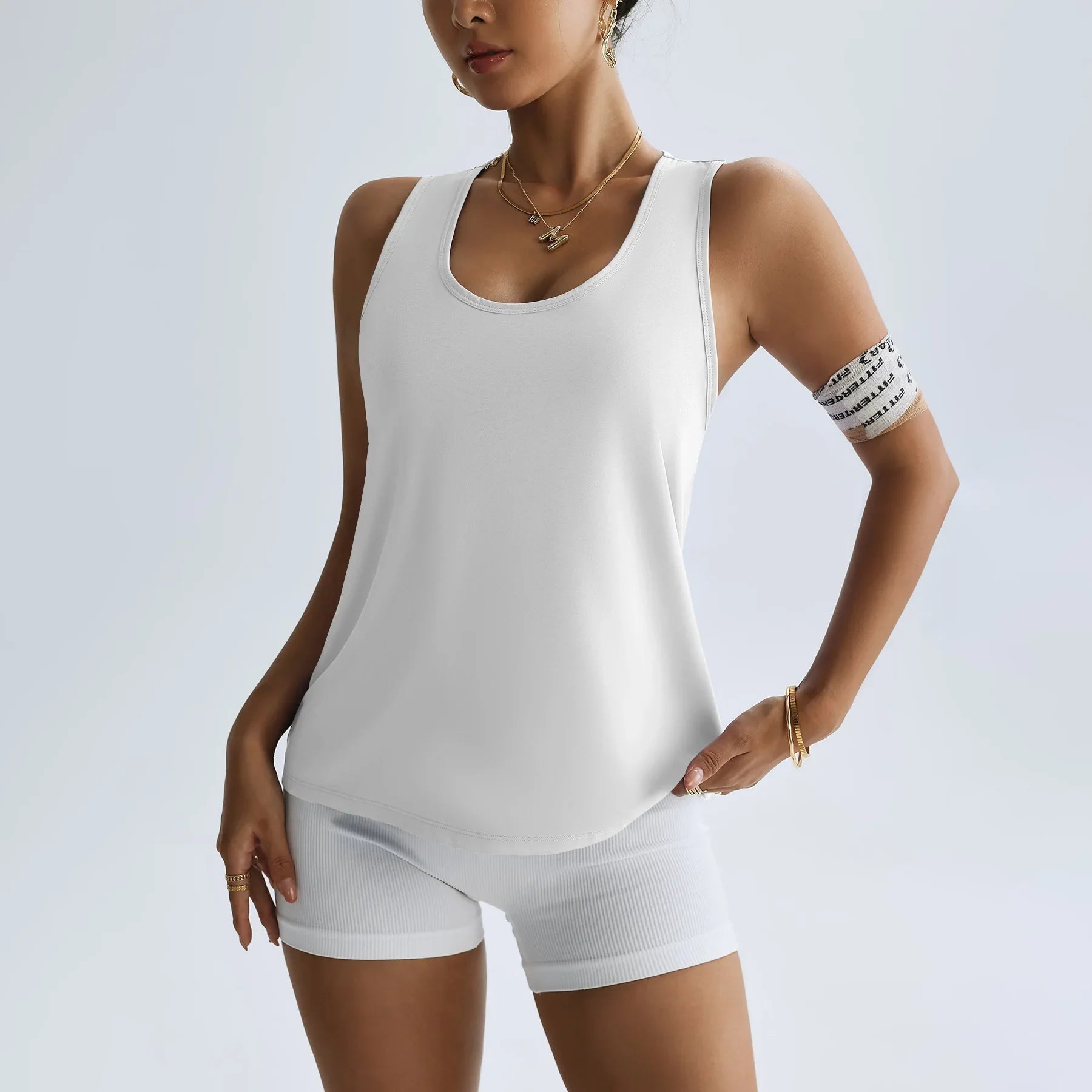 KiKis women's quick dry yoga top in white sleeveless design paired with matching shorts